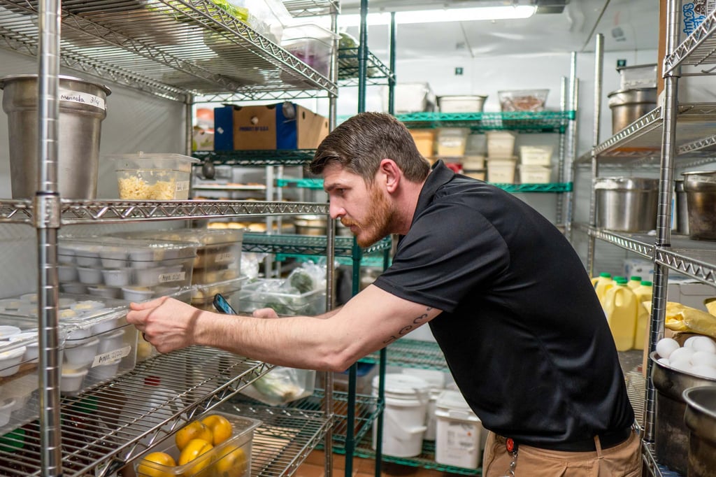 Eggspectation employee checking inventory