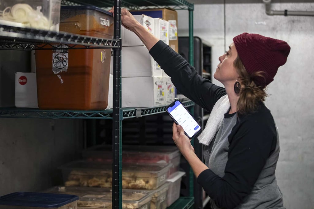 Tafts Brewing Co. employee taking inventory