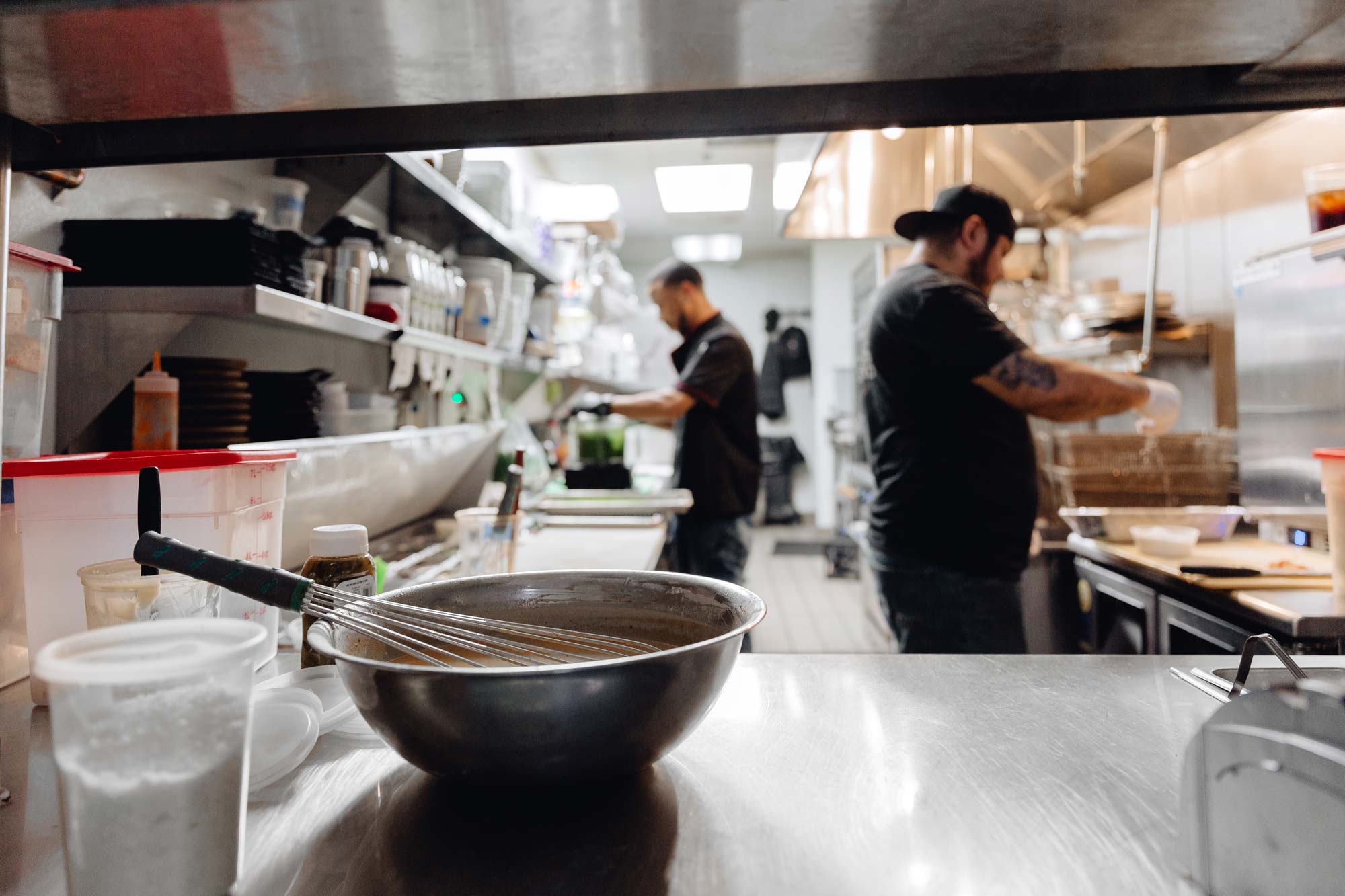 Back kitchen with employees cooking